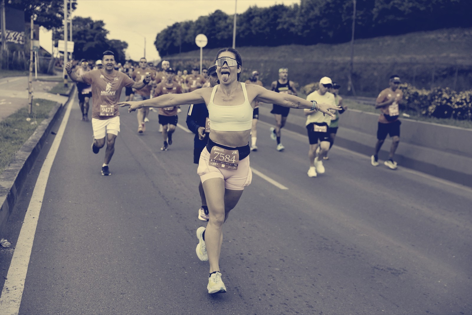 Runners celebrating with arms outstretched