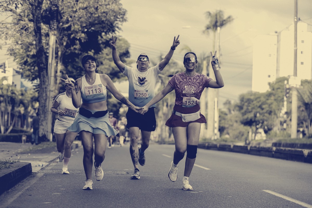 Three friends celebrating mid-race